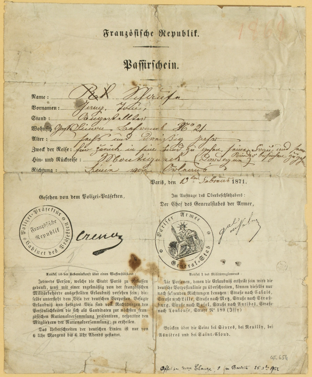 Gelbliches deutsches Regierungsdokument mit einem kreisförmigen schwarzen Randstempel und schwarzer Tintenbeschriftung.