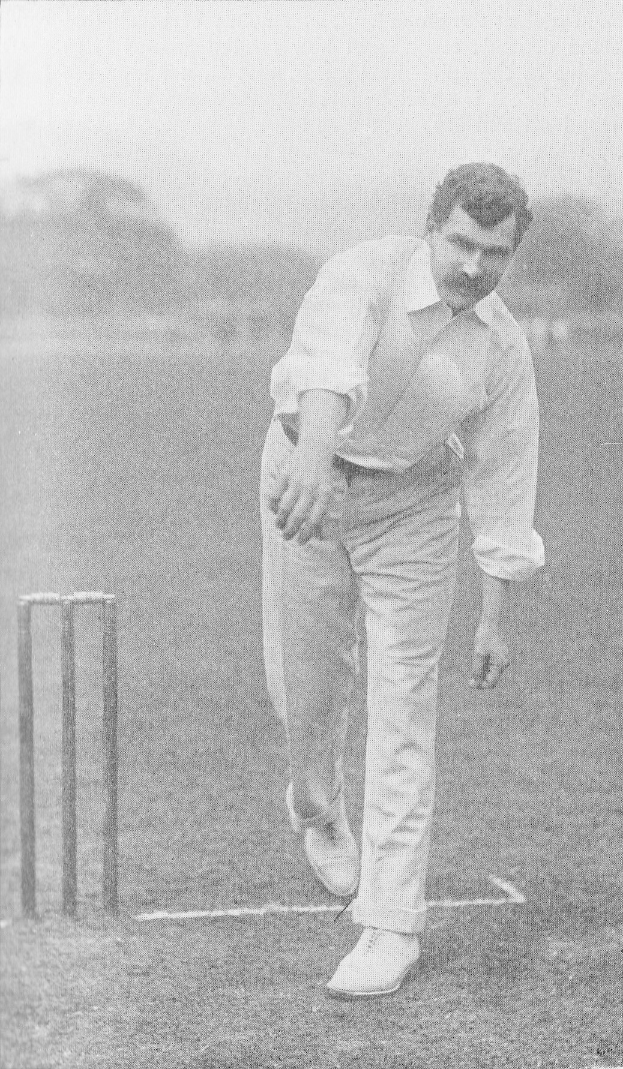 Ein Mann in einem weißen Hemd und Hosen spielt Cricket mit Wickets auf dem Boden, Bäumen und Himmel im Hintergrund, mit dem Text "Cricket Player of the Year" unten.